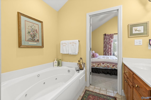 6468 Turtle Bay Way E, Athens, AL 35611 - full bath featuring lofted ceiling, a whirlpool tub, vanity, and connected bathroom