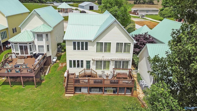 6468 Turtle Bay Way E, Athens, AL 35611 - back of house featuring a deck, a lawn, and metal roof