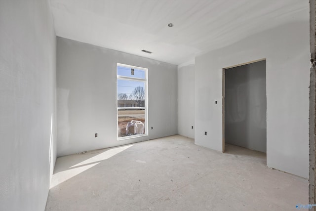 unfurnished bedroom featuring visible vents