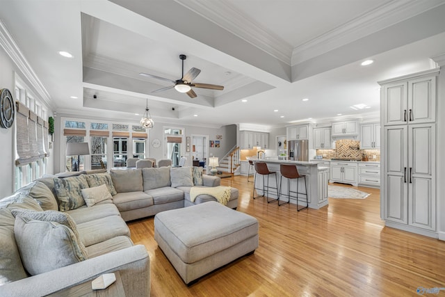 living area with stairs, recessed lighting, light wood-type flooring, and ornamental molding