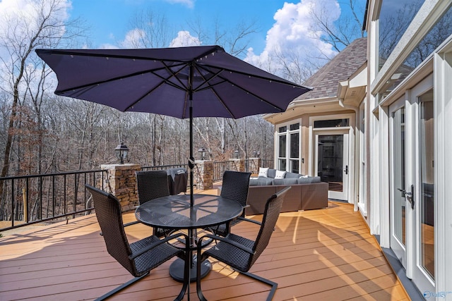 deck featuring an outdoor living space and outdoor dining area