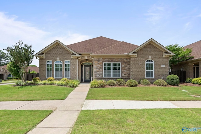 907 Binding Br NW, Huntsville, AL 35806 - view of front of property featuring a front lawn, brick siding, and roof with shingles