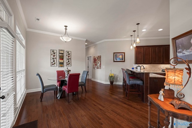 907 Binding Br NW, Huntsville, AL 35806 - dining space with dark wood finished floors, recessed lighting, and ornamental molding