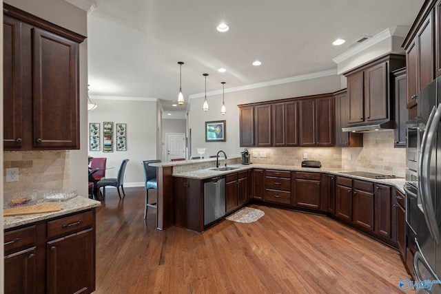 907 Binding Br NW, Huntsville, AL 35806 - kitchen featuring dishwasher, a peninsula, black electric stovetop, decorative backsplash, and under cabinet range hood