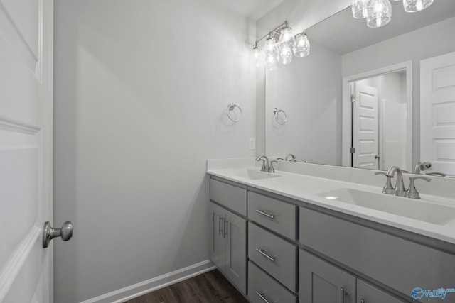 bathroom with hardwood / wood-style floors and vanity