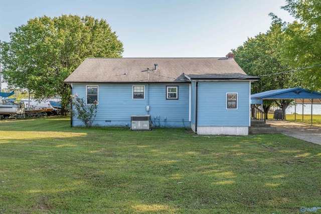 220 County Road 564, Leesburg, AL 35983 - rear view of property featuring roof with shingles, a carport, central AC, a lawn, and crawl space