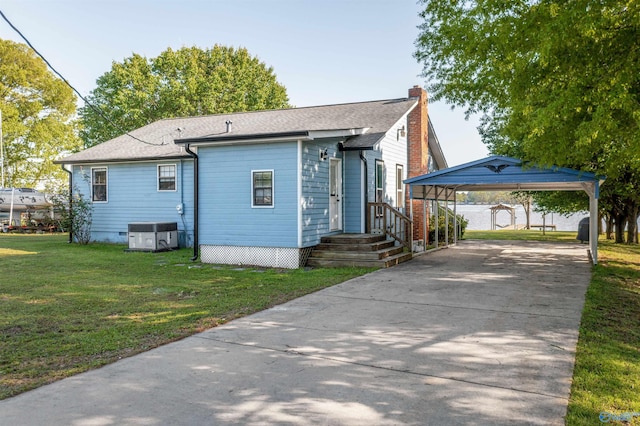 220 County Road 564, Leesburg, AL 35983 - exterior space featuring a chimney, central air condition unit, driveway, a lawn, and a detached carport
