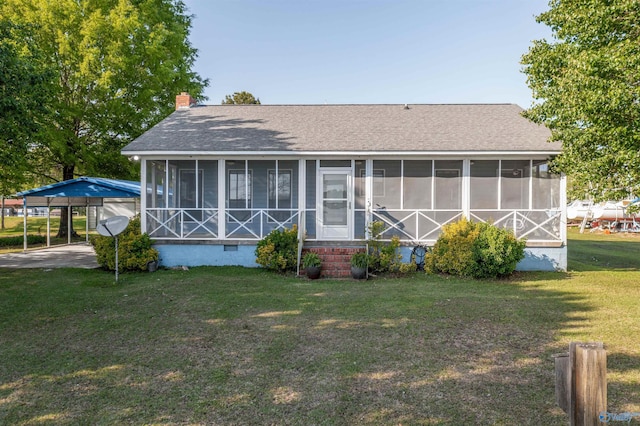 220 County Road 564, Leesburg, AL 35983 - rear view of house with a lawn, a sunroom, crawl space, and a shingled roof