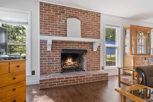220 County Road 564, Leesburg, AL 35983 - sitting room featuring hardwood / wood-style floors, a brick fireplace, and baseboards