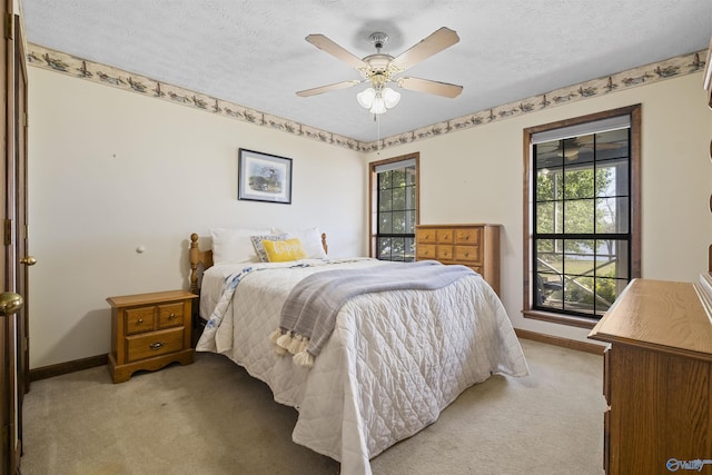 220 County Road 564, Leesburg, AL 35983 - bedroom with light carpet, baseboards, and a textured ceiling