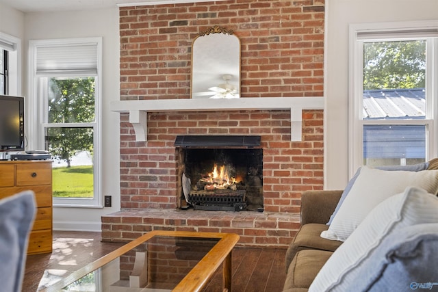 220 County Road 564, Leesburg, AL 35983 - living room featuring a fireplace, wood finished floors, a healthy amount of sunlight, and ceiling fan