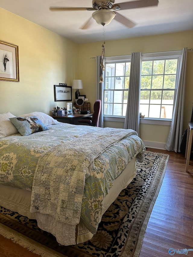 bedroom featuring dark wood-type flooring and ceiling fan