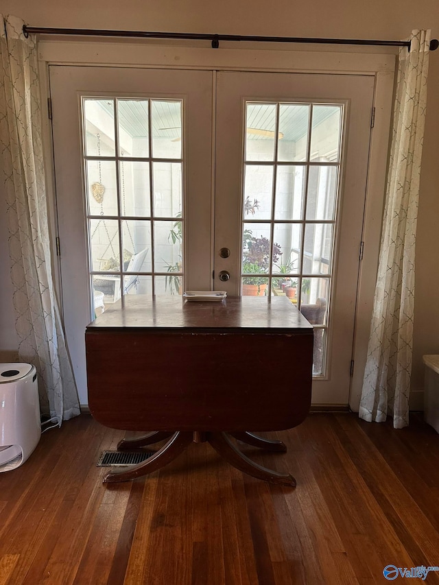 doorway to outside featuring french doors and dark hardwood / wood-style flooring