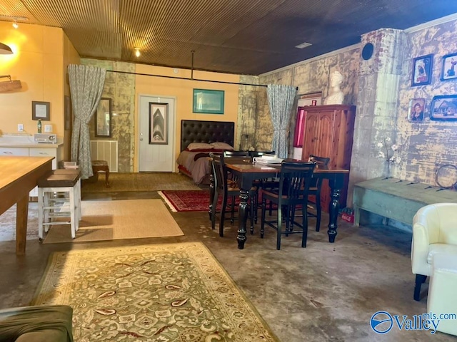 dining room with concrete flooring