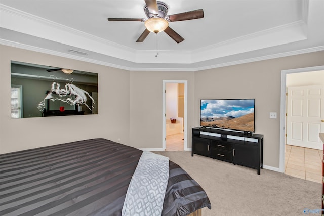 tiled bedroom featuring carpet flooring, a ceiling fan, baseboards, a raised ceiling, and crown molding