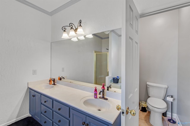 bathroom with double vanity, a stall shower, a sink, and toilet