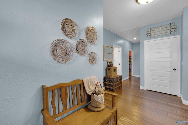 hallway with dark hardwood / wood-style floors