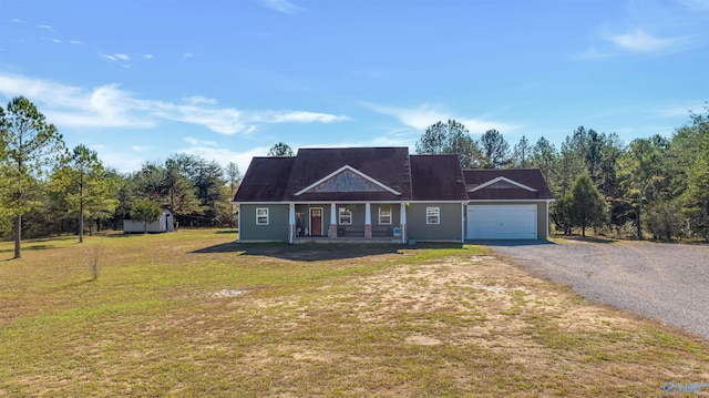 view of front of home with a front lawn, a porch, and a garage