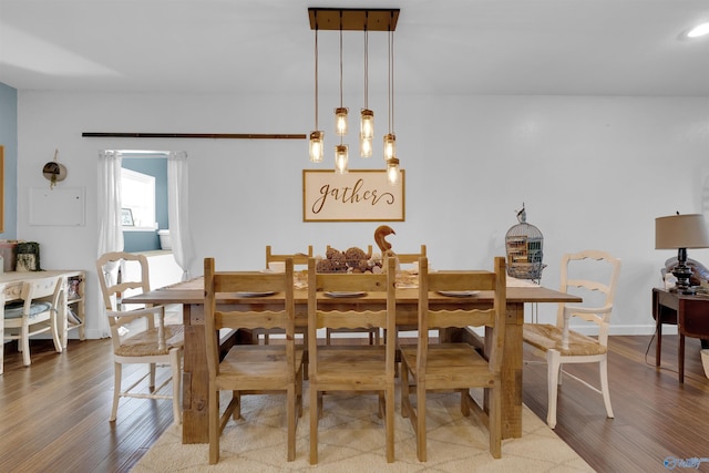 dining room with hardwood / wood-style floors