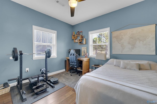 bedroom featuring hardwood / wood-style floors and ceiling fan