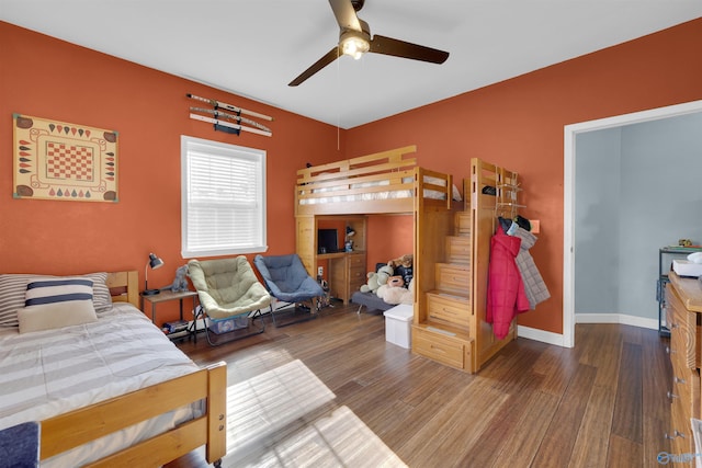 bedroom featuring ceiling fan and hardwood / wood-style flooring