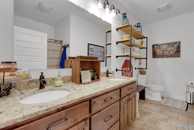 bathroom with vanity and toilet