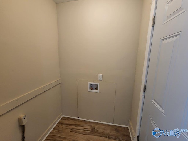 washroom with hookup for a washing machine and dark hardwood / wood-style floors