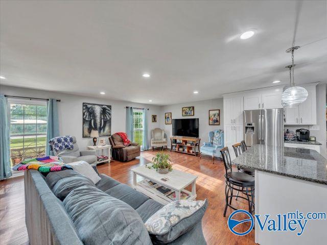 living area featuring recessed lighting and light wood-type flooring