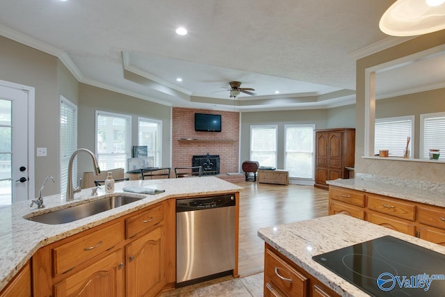 14850 Creek Ln, Athens, AL 35613 - kitchen featuring stainless steel dishwasher, a sink, black electric cooktop, a brick fireplace, and ceiling fan