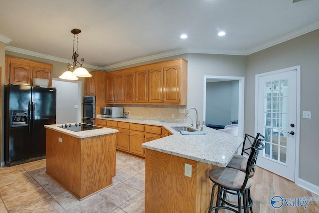 14850 Creek Ln, Athens, AL 35613 - kitchen with black appliances, a sink, a peninsula, crown molding, and a kitchen island