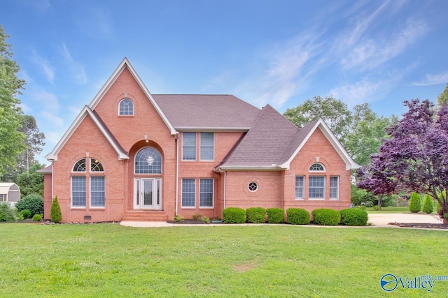14850 Creek Ln, Athens, AL 35613 - view of front of property featuring brick siding, entry steps, a front lawn, and roof with shingles