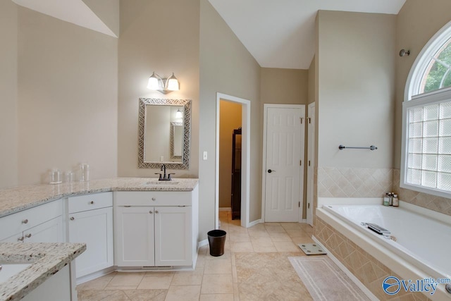 14850 Creek Ln, Athens, AL 35613 - full bath featuring vanity, a garden tub, tile patterned flooring, and baseboards