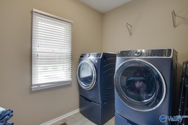 14850 Creek Ln, Athens, AL 35613 - laundry area featuring washer and dryer, healthy amount of natural light, and baseboards