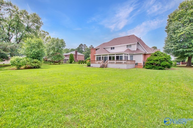 14850 Creek Ln, Athens, AL 35613 - back of house featuring a yard, a sunroom, and a deck