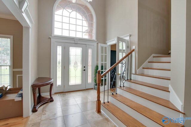 14850 Creek Ln, Athens, AL 35613 - tiled entryway featuring a high ceiling and stairway
