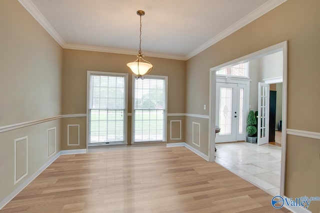 14850 Creek Ln, Athens, AL 35613 - unfurnished dining area with crown molding, light wood finished floors, and baseboards