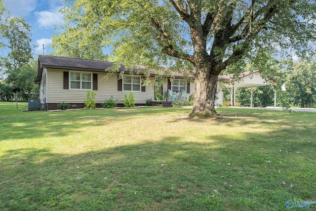 ranch-style house featuring crawl space, central AC, and a front lawn