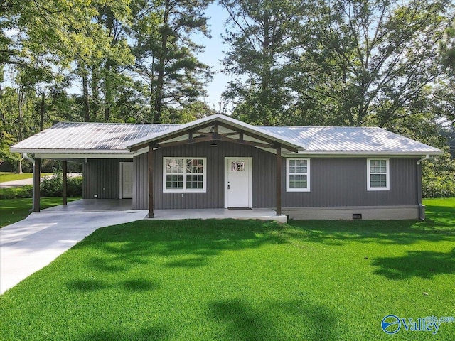 ranch-style home with a carport and a front yard