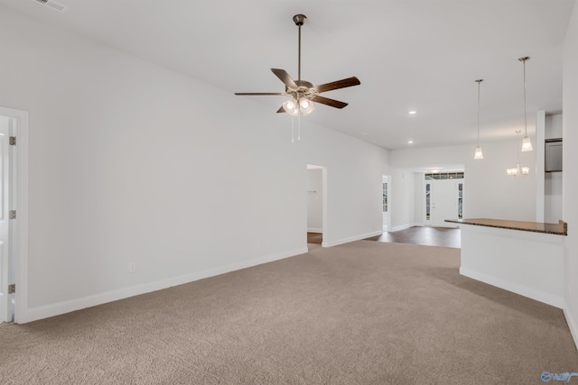 unfurnished living room with recessed lighting, ceiling fan, baseboards, and carpet