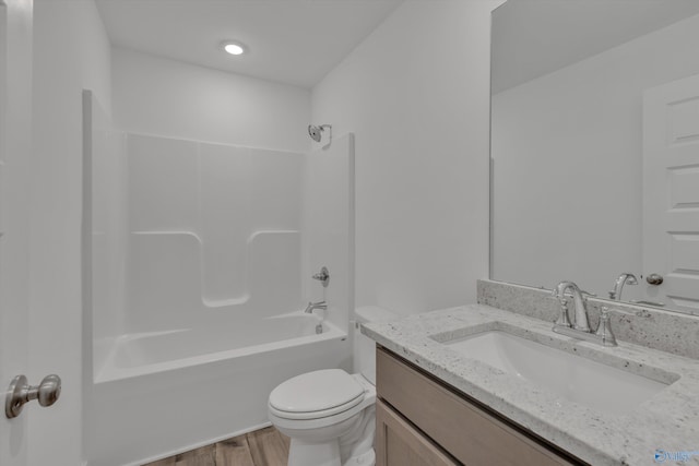 full bathroom with vanity, wood-type flooring, toilet, and shower / bath combination