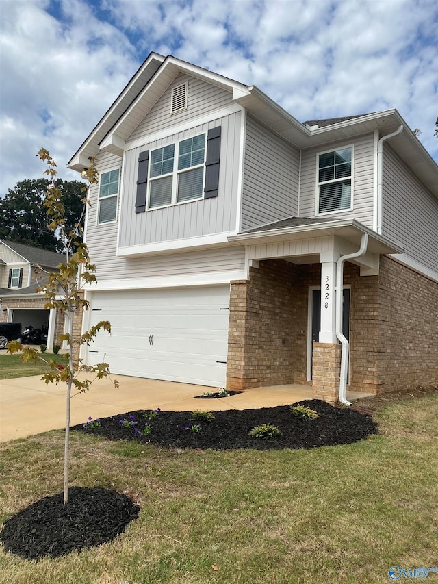 craftsman house featuring a garage and a front lawn