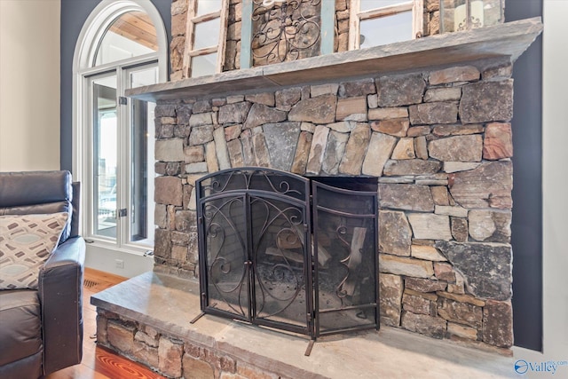 room details featuring wood finished floors and a fireplace