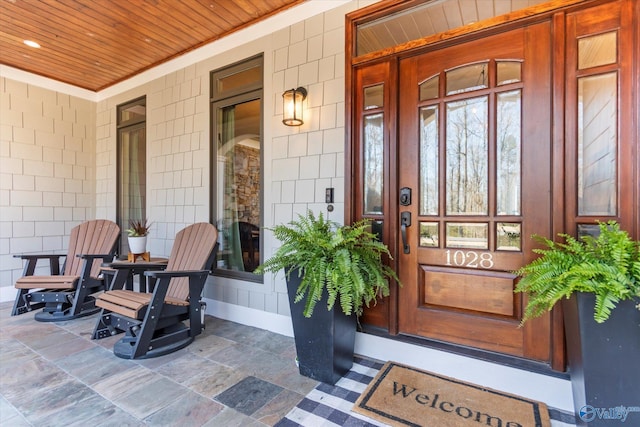 doorway to property featuring a porch