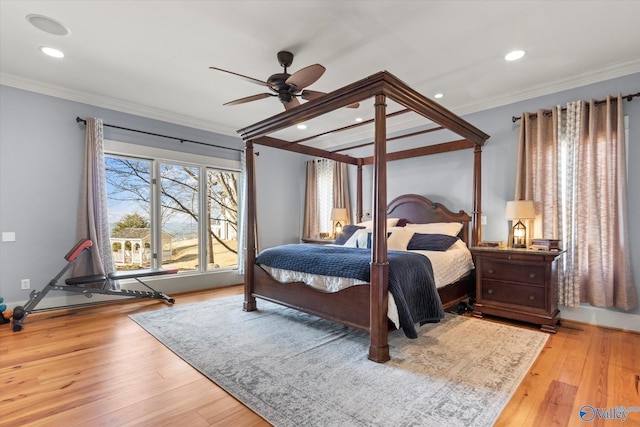 bedroom featuring recessed lighting, wood finished floors, and ornamental molding