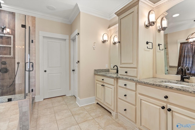 bathroom featuring double vanity, ornamental molding, a stall shower, and a sink