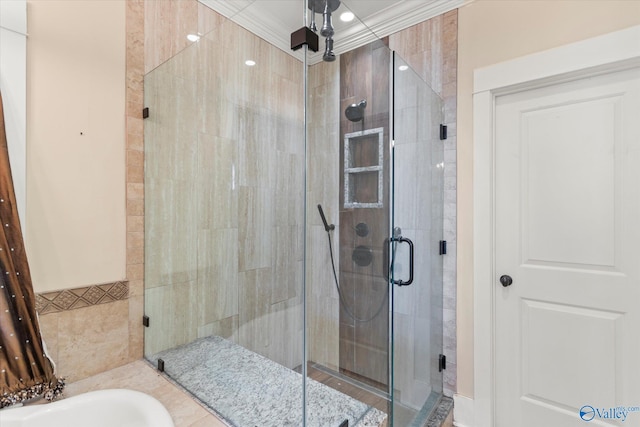 full bath featuring a shower stall and crown molding