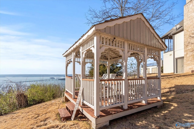 wooden terrace with a gazebo and a water view