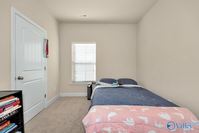 bedroom featuring baseboards, visible vents, and carpet flooring