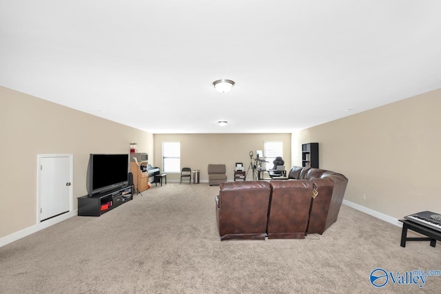 living room featuring baseboards and carpet flooring