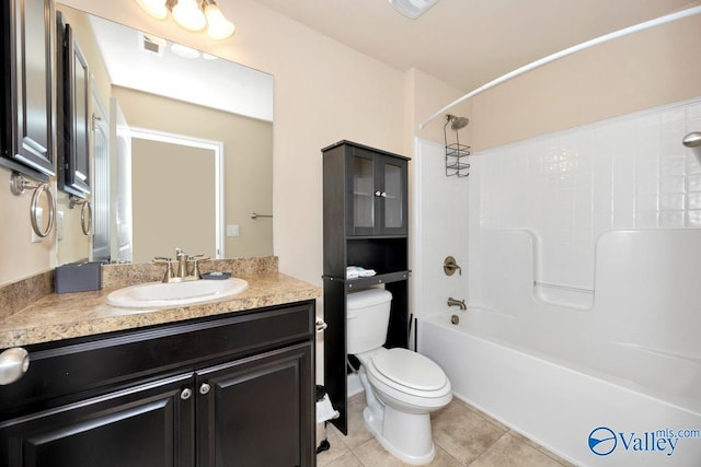 full bathroom with bathtub / shower combination, toilet, vanity, visible vents, and tile patterned floors